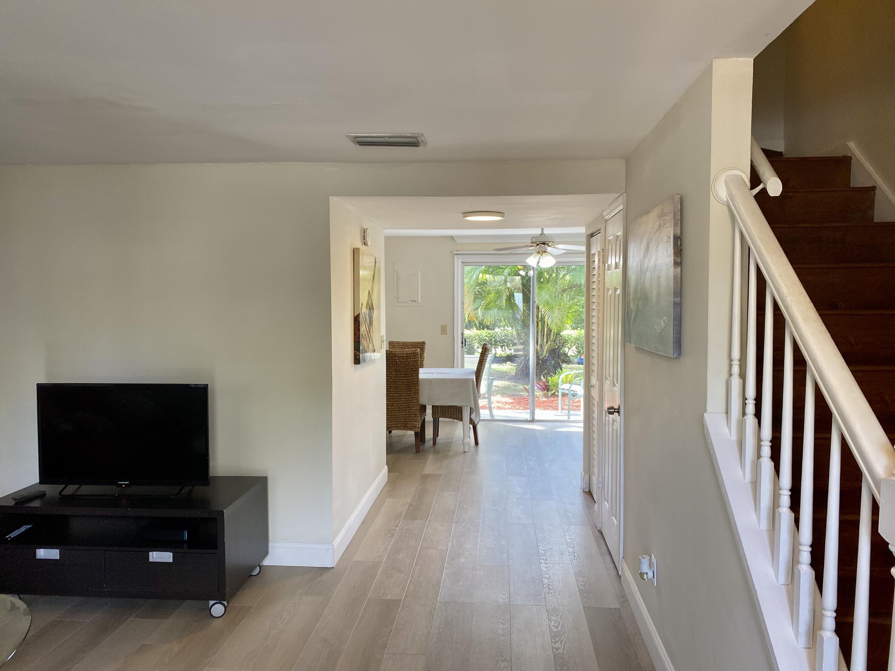 13472 Old Englishtown Road Wellington, FL 33414 - Photo 6 of 18 a living room with furniture and a flat screen tv
