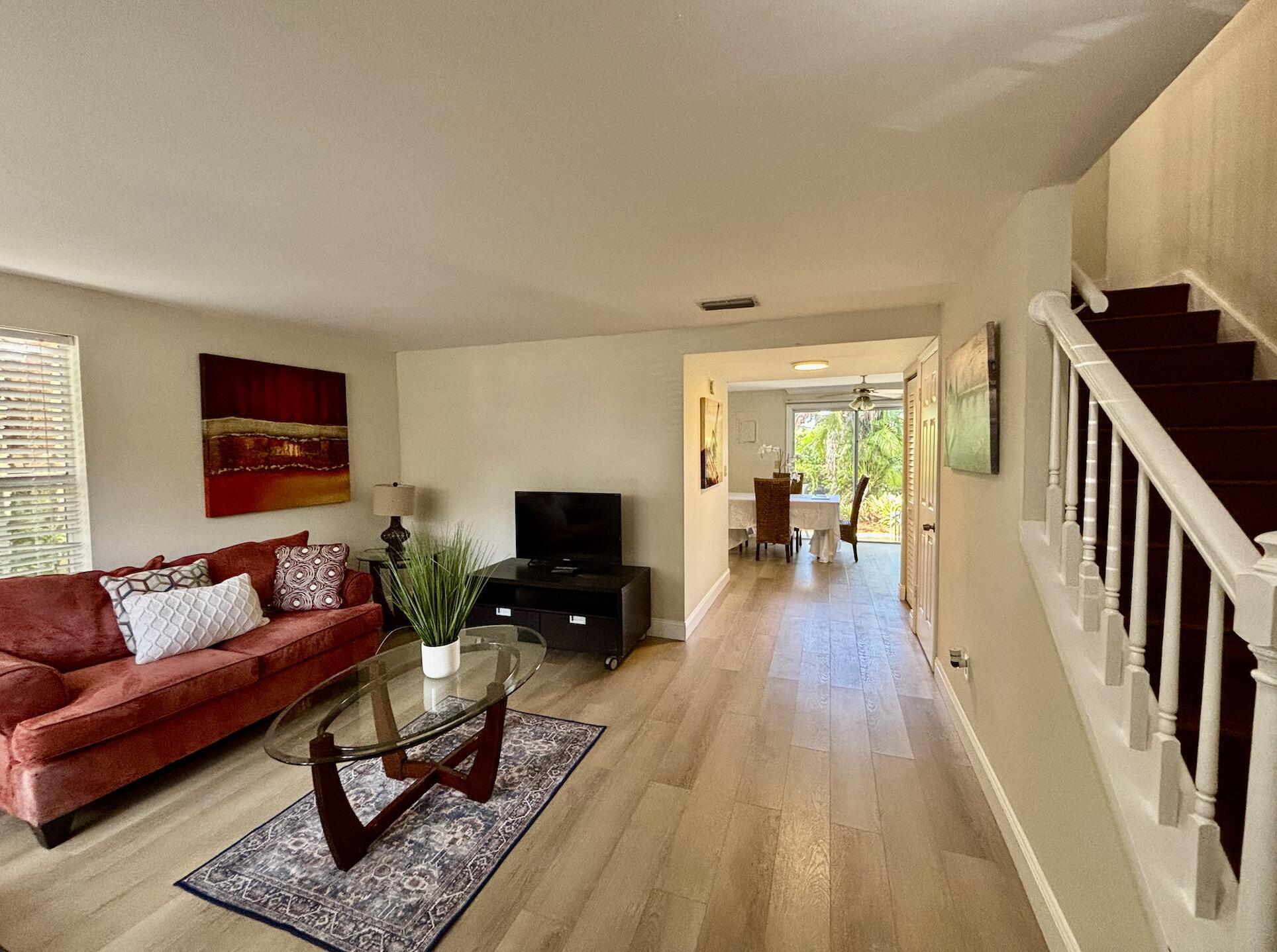 13472 Old Englishtown Road Wellington, FL 33414 - Photo 7 of 18 a living room with furniture and a flat screen tv