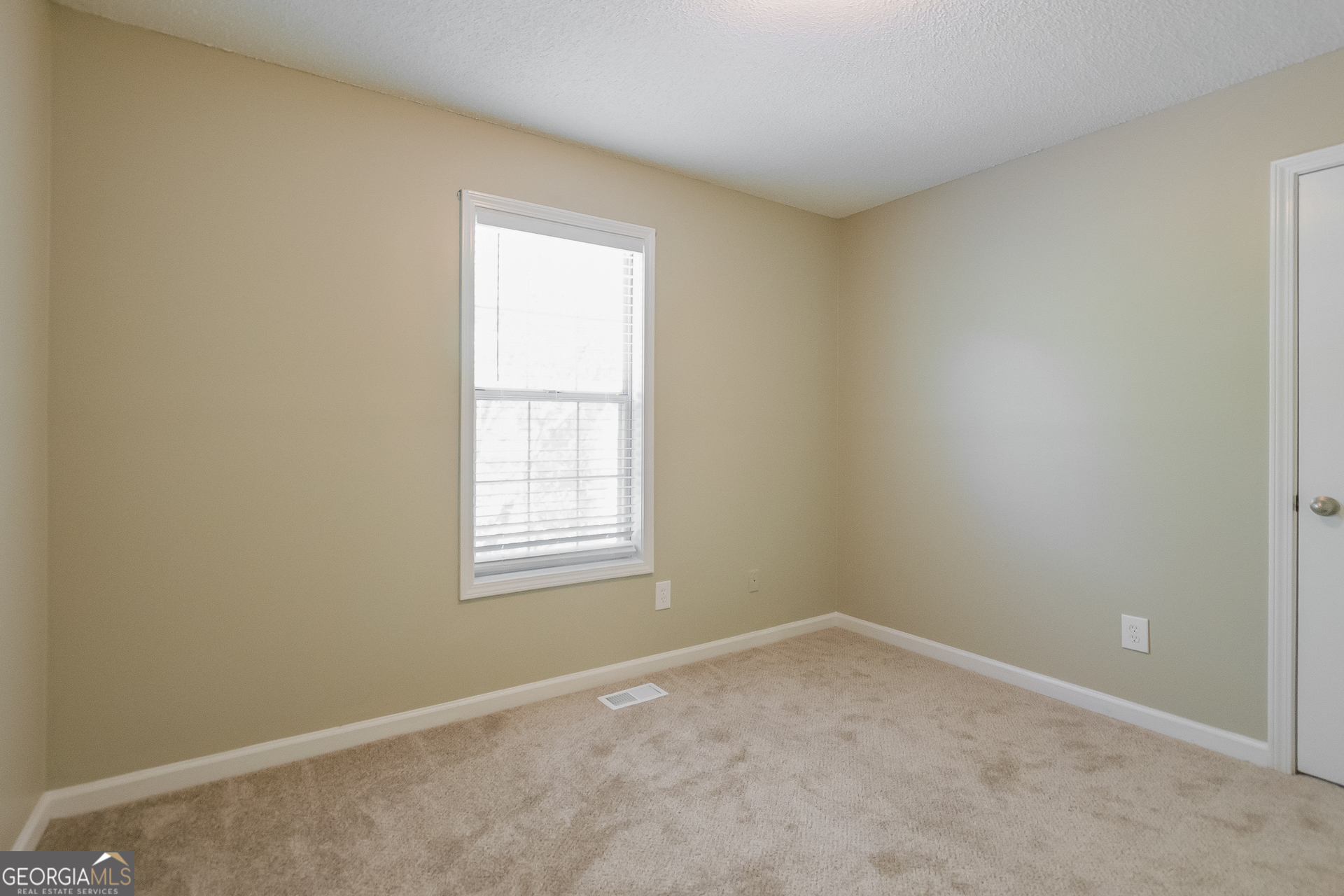2353 Loren Falls Lane Southwest Marietta, GA 30008 - Photo 11 of 17 an empty room with a window