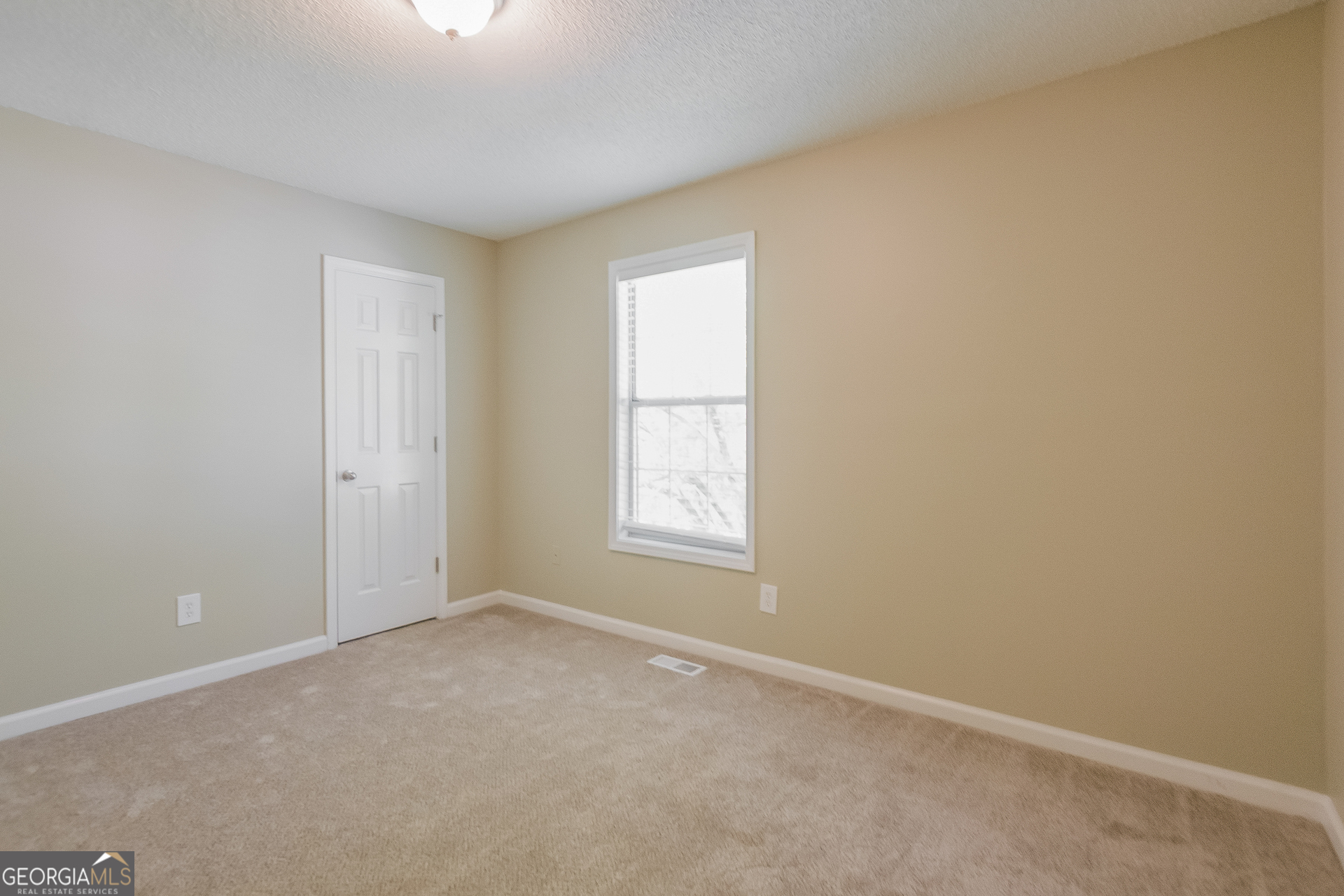 2353 Loren Falls Lane Southwest Marietta, GA 30008 - Photo 12 of 17 an empty room with windows