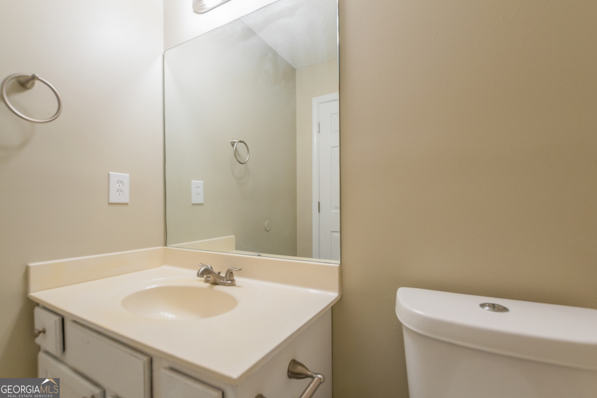 2353 Loren Falls Lane Southwest Marietta, GA 30008 - Photo 13 of 17 a bathroom with a sink a toilet and a mirror