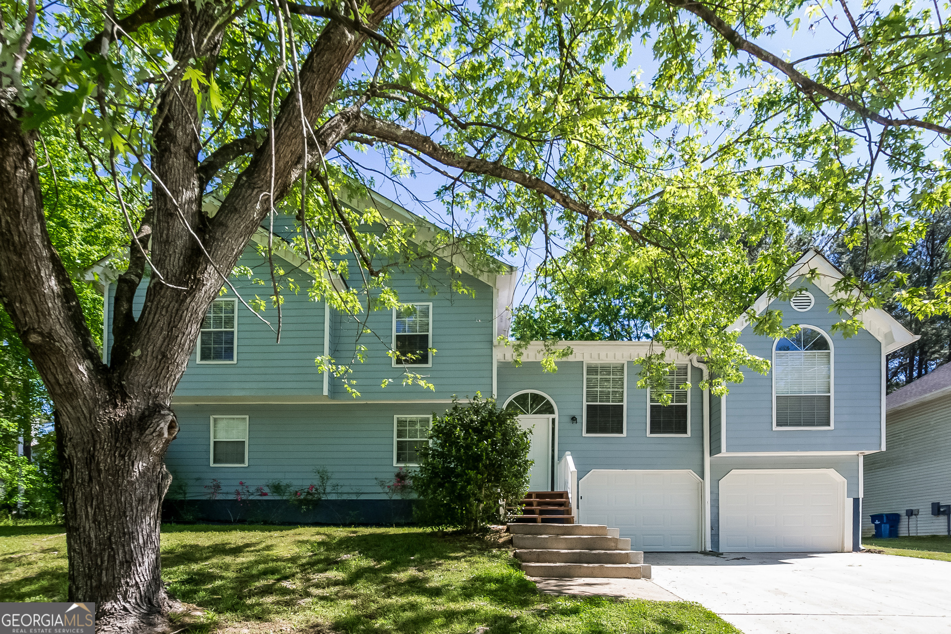 2353 Loren Falls Lane Southwest Marietta, GA 30008 - Photo 2 of 17 a front view of a house with garden