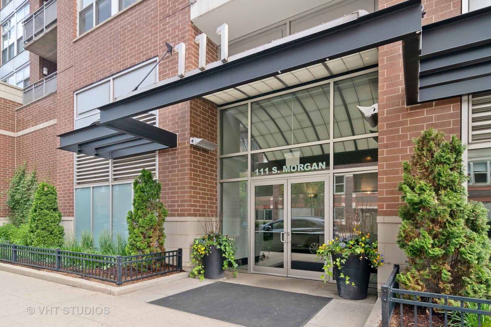 a house view with a potted plant in front of it