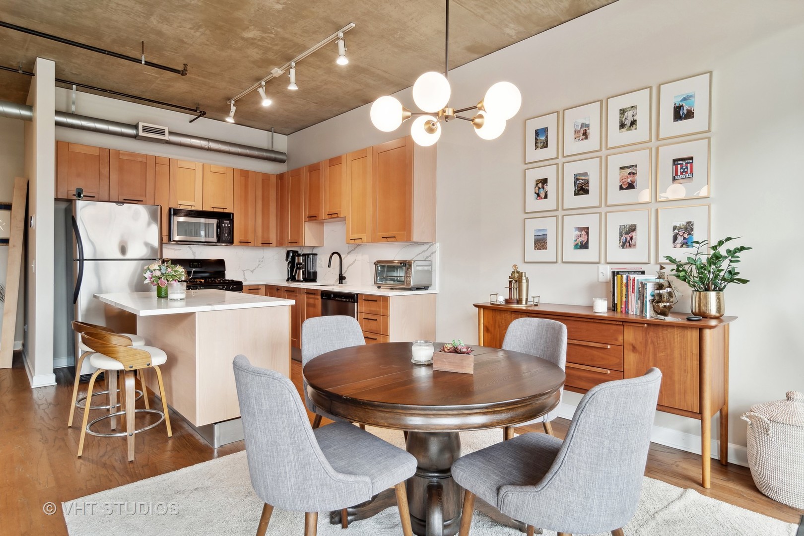 Undisclosed Address Chicago, IL 60607 - Photo 13 of 22 a dining room with furniture a kitchen a chandelier and wooden floor