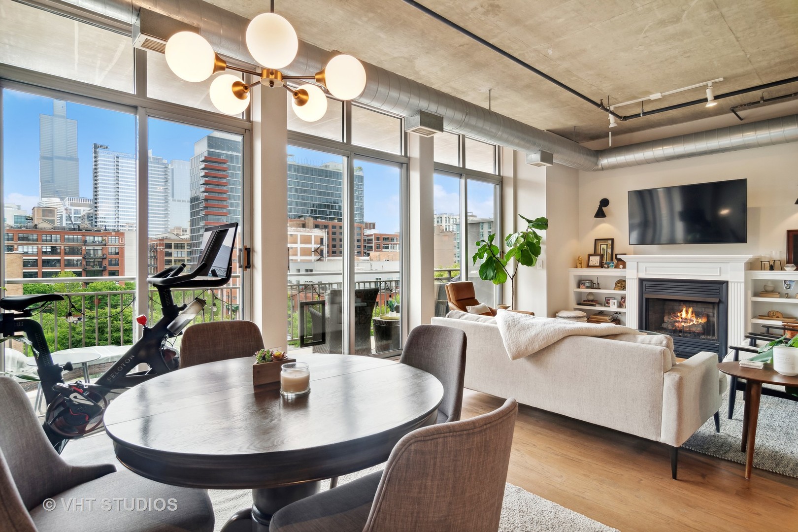 Undisclosed Address Chicago, IL 60607 - Photo 8 of 22 a living room with fireplace furniture and a flat screen tv