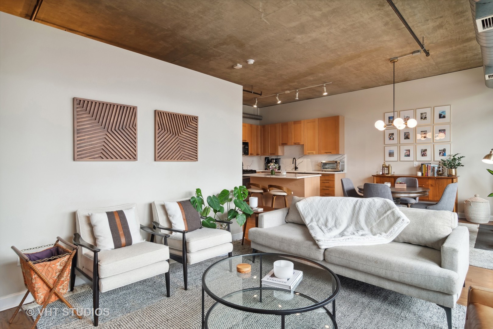 Undisclosed Address Chicago, IL 60607 - Photo 9 of 22 a living room with furniture kitchen view and a chandelier