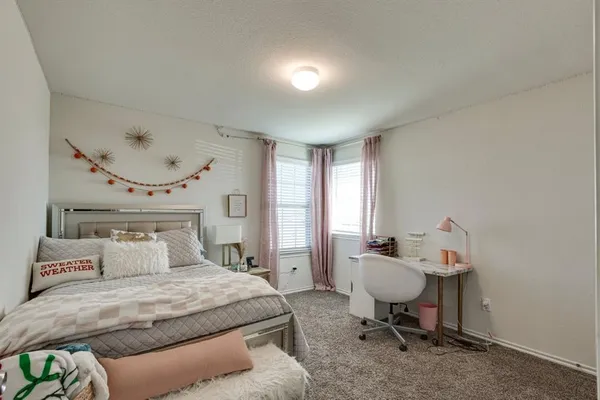 a bedroom with a bed and furniture