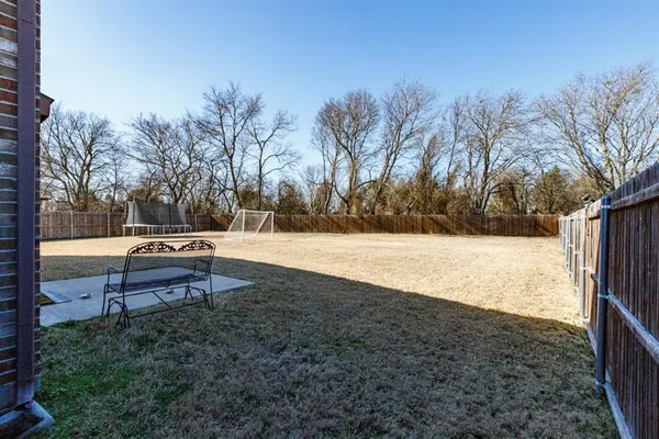 a park view with wooden fence