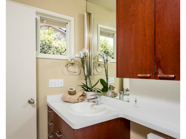2202 Greer Road Palo Alto, CA 94303 - Photo 11 of 18 a bathroom with a sink and a mirror