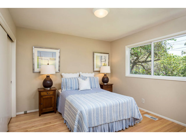 2202 Greer Road Palo Alto, CA 94303 - Photo 13 of 18 a bedroom with a large bed and a window