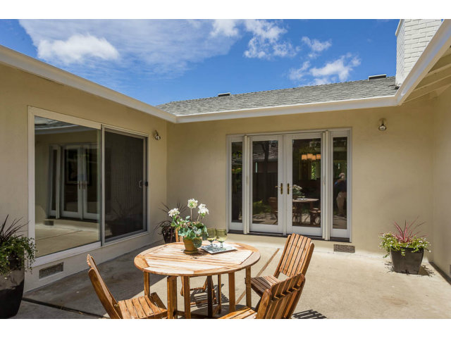 2202 Greer Road Palo Alto, CA 94303 - Photo 14 of 18 a view of a patio with table and chairs and potted plants