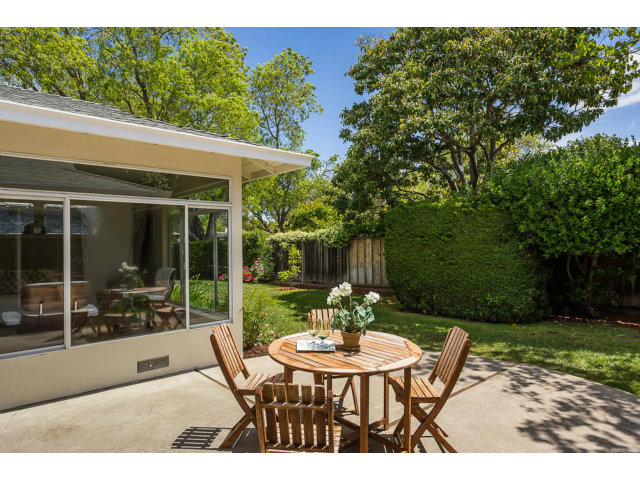 2202 Greer Road Palo Alto, CA 94303 - Photo 15 of 18 a view of a patio with a table chairs and a backyard