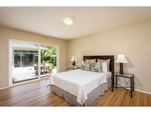 2202 Greer Road Palo Alto, CA 94303 - Photo 8 of 18 a bedroom with a bed and a large window