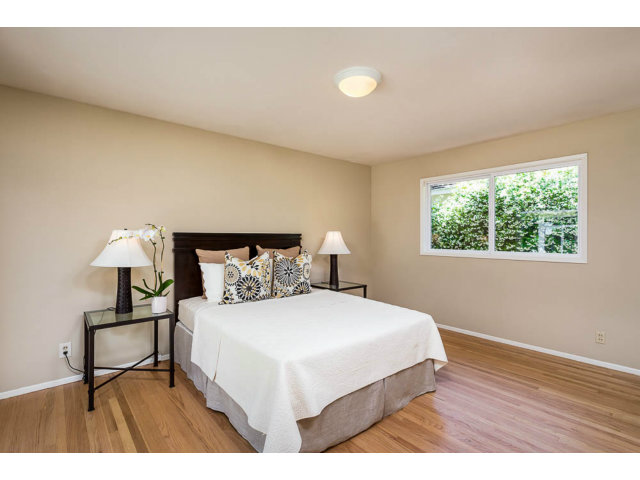 2202 Greer Road Palo Alto, CA 94303 - Photo 9 of 18 a bedroom with a bed and a night stand