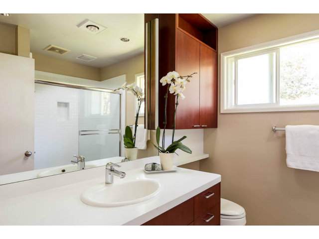 2202 Greer Road Palo Alto, CA 94303 - Photo 10 of 18 a bathroom with a sink and a mirror