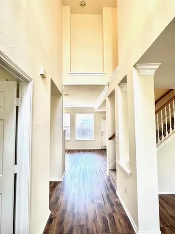 a view of an entryway with wooden floor
