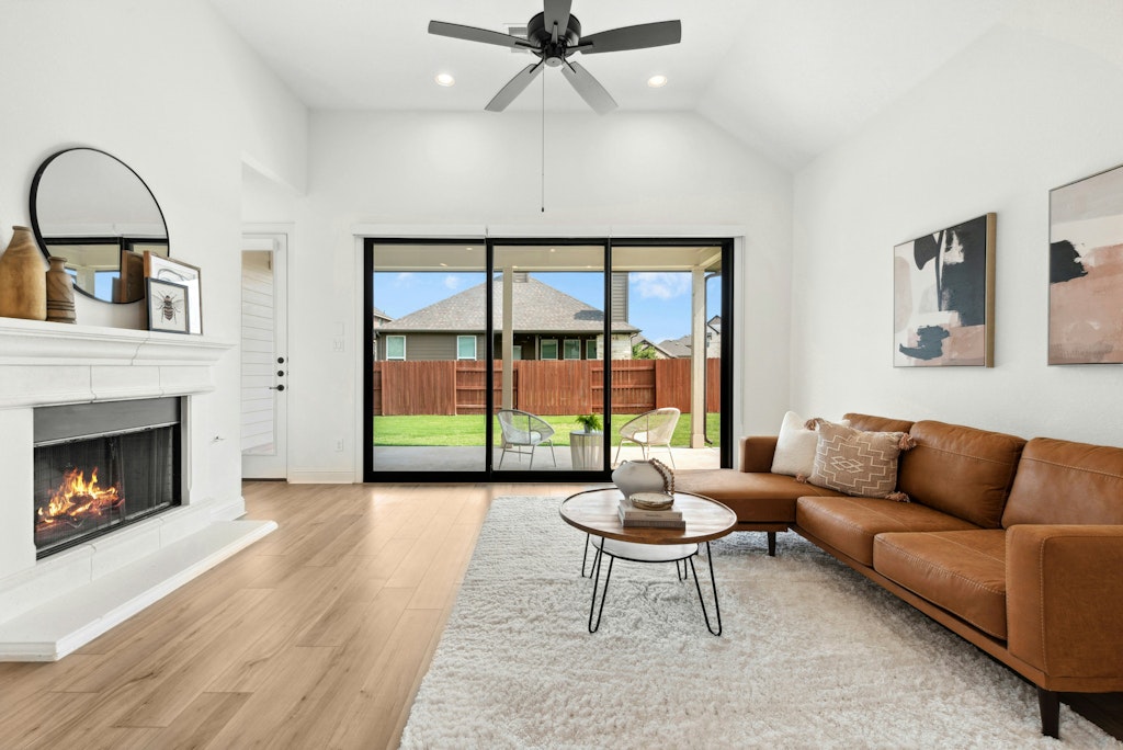 a living room with furniture and a fireplace