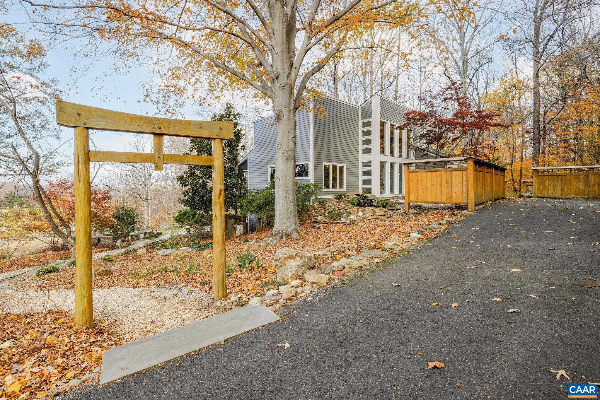 407 Broad Axe Road Charlottesville, VA 22903 - Photo 12 of 57 a view of a house with a yard covered in snow