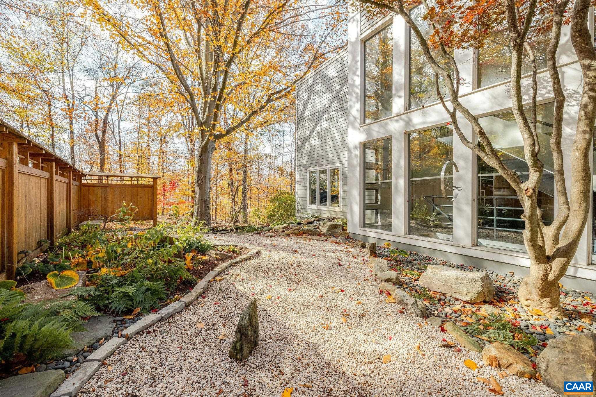 407 Broad Axe Road Charlottesville, VA 22903 - Photo 13 of 57 a view of a house with a yard covered in snow