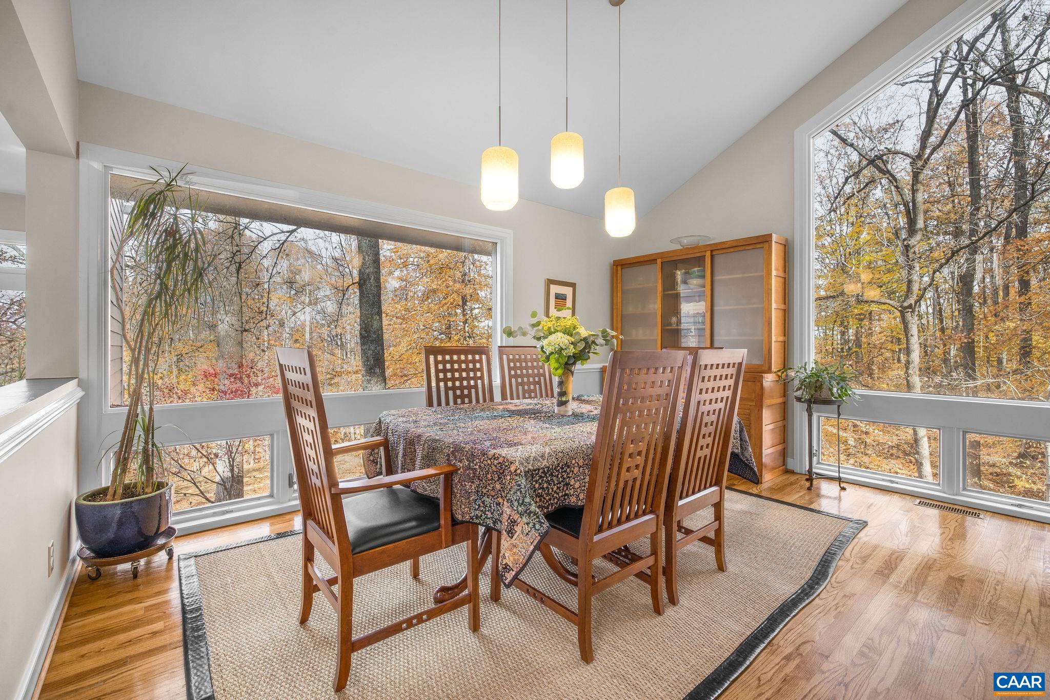 407 Broad Axe Road Charlottesville, VA 22903 - Photo 23 of 57 a view of a dining room with furniture window and wooden floor