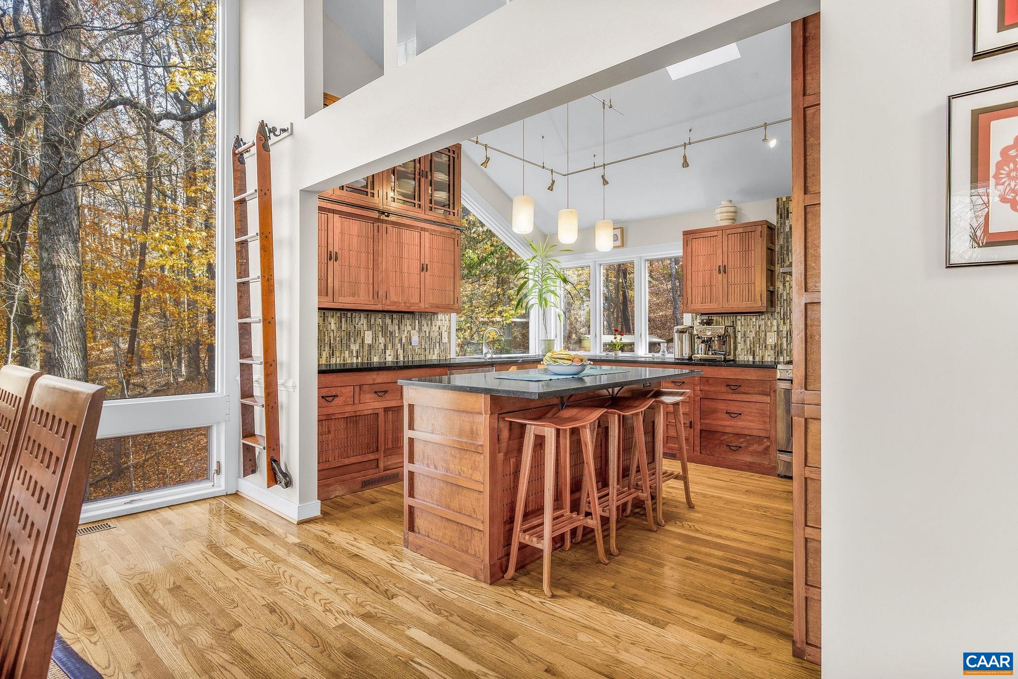 407 Broad Axe Road Charlottesville, VA 22903 - Photo 25 of 57 a open kitchen with a sink and breakfast area
