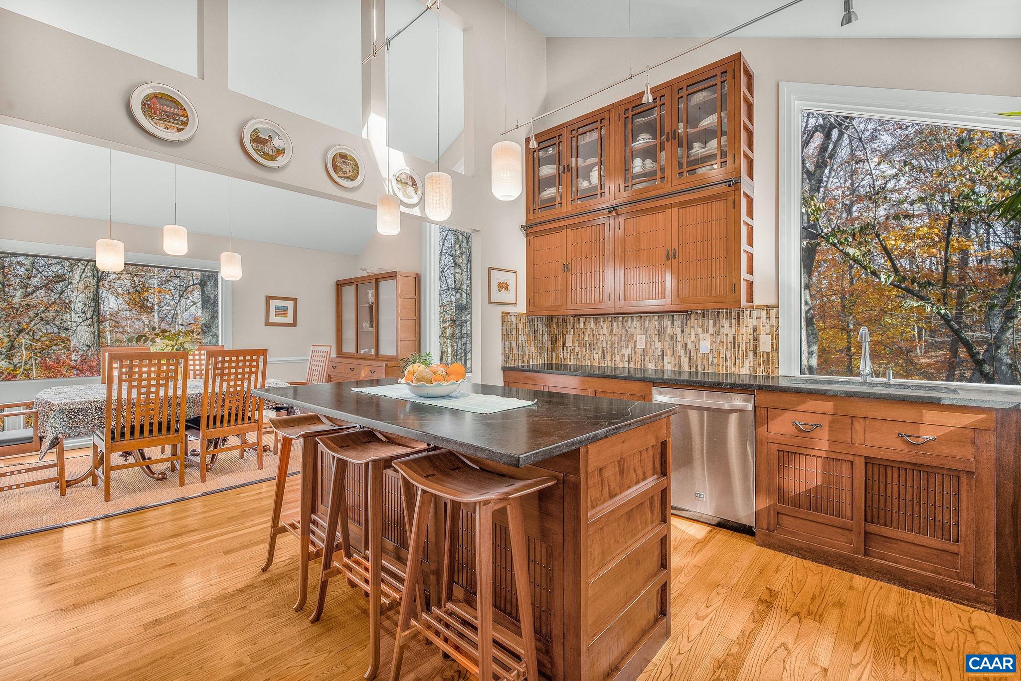 407 Broad Axe Road Charlottesville, VA 22903 - Photo 27 of 57 a kitchen with stainless steel appliances granite countertop a stove and a refrigerator