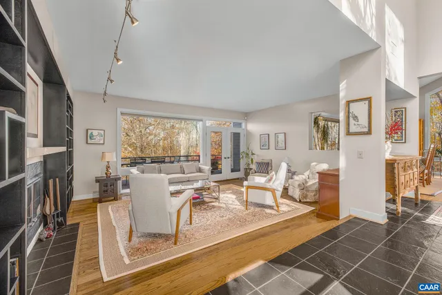 a bathroom with a granite countertop toilet sink and mirror