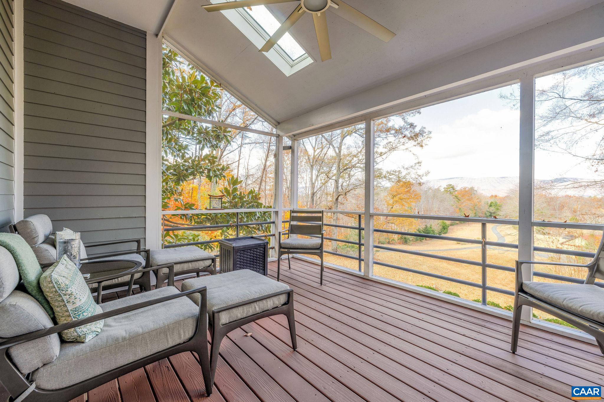 407 Broad Axe Road Charlottesville, VA 22903 - Photo 39 of 57 a living room with furniture and a floor to ceiling window
