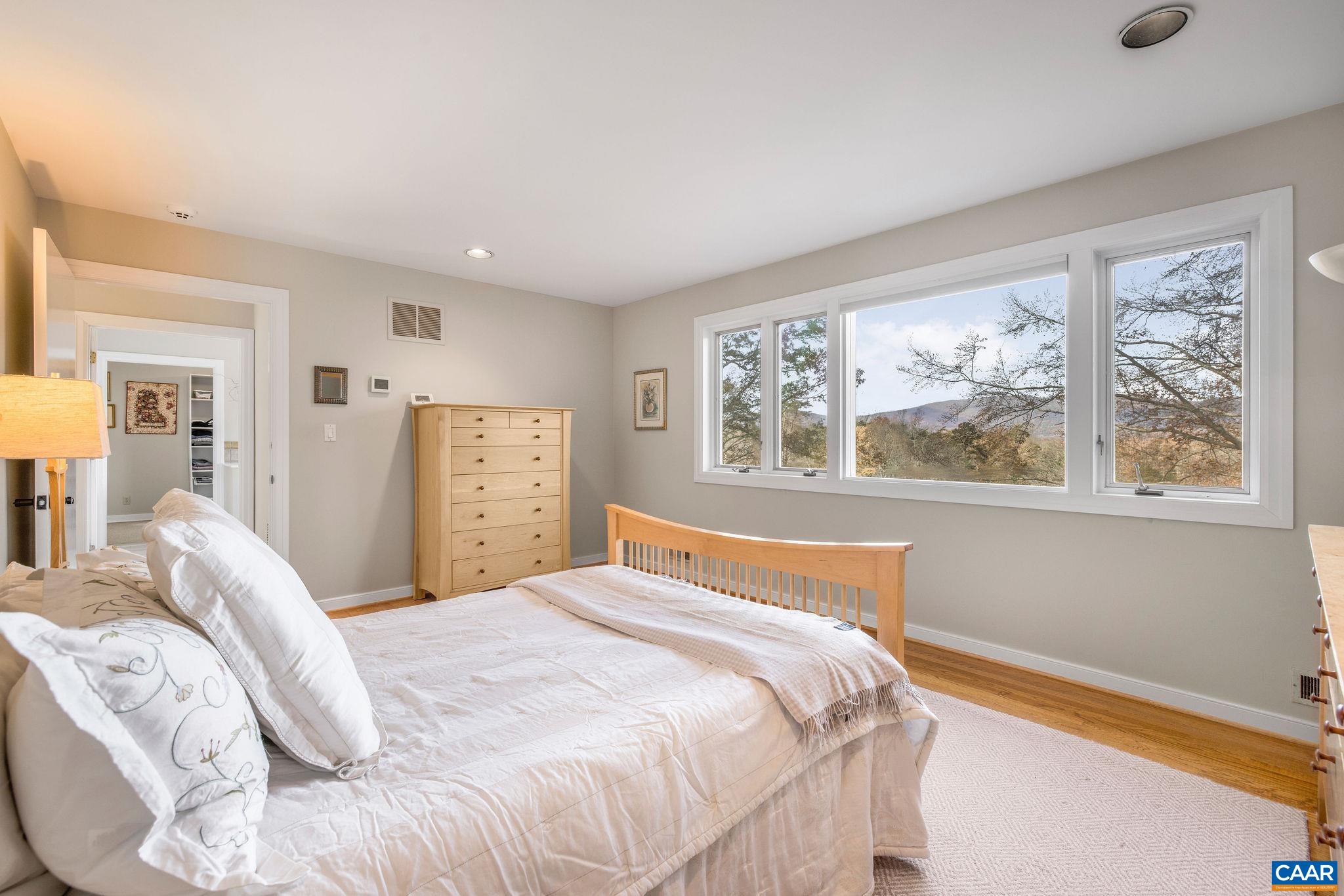 407 Broad Axe Road Charlottesville, VA 22903 - Photo 45 of 57 a bedroom with a large bed and a window