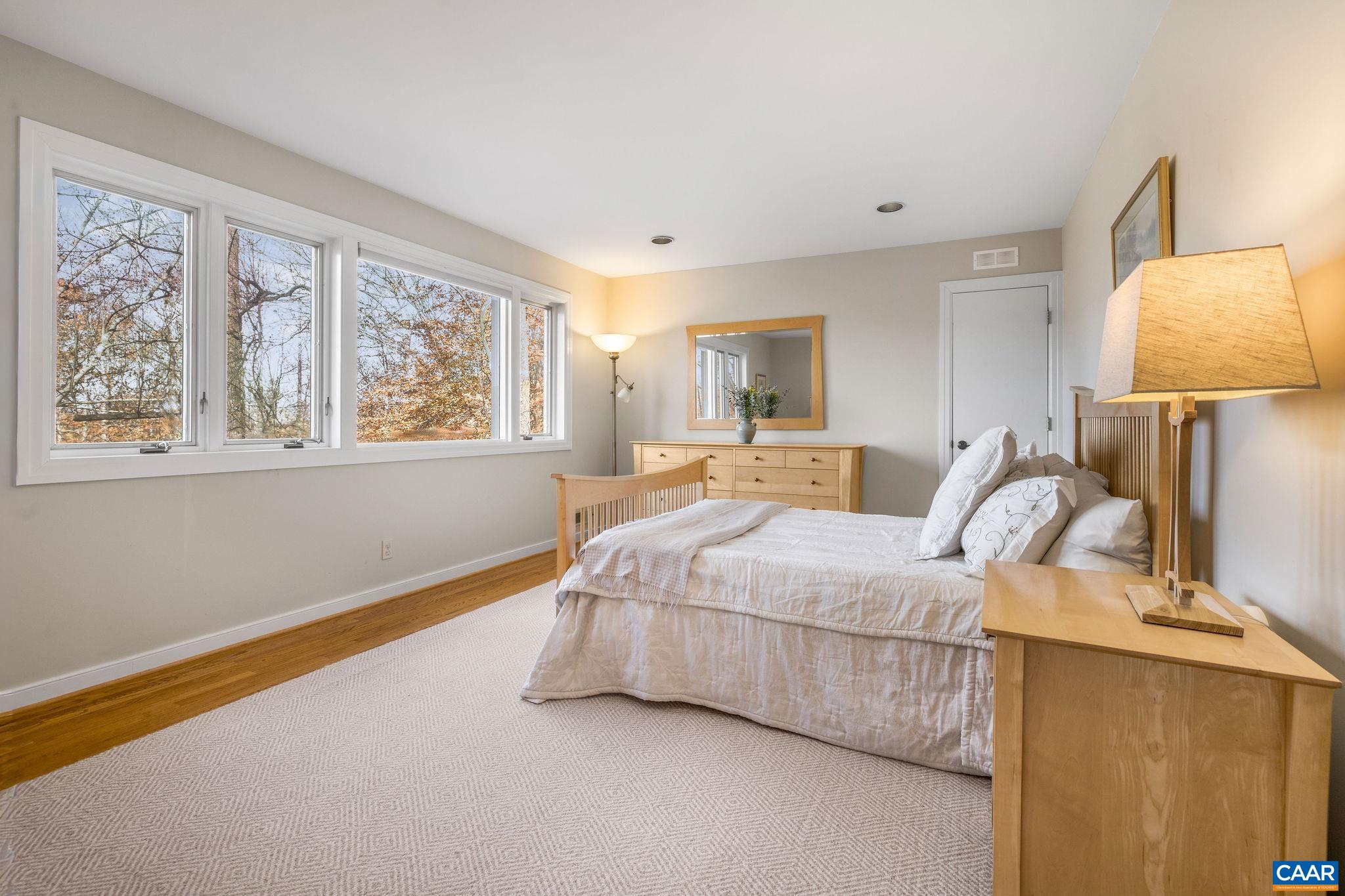 407 Broad Axe Road Charlottesville, VA 22903 - Photo 46 of 57 a bed room with a bed and a night stand