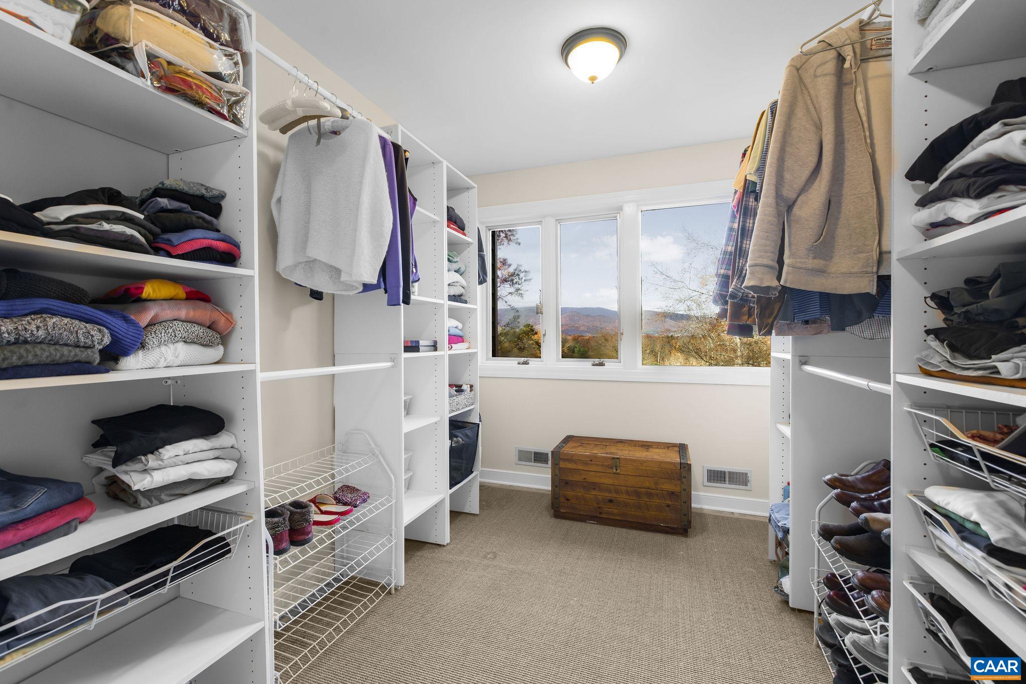 407 Broad Axe Road Charlottesville, VA 22903 - Photo 47 of 57 a view of walk in closet with clothes and shoes