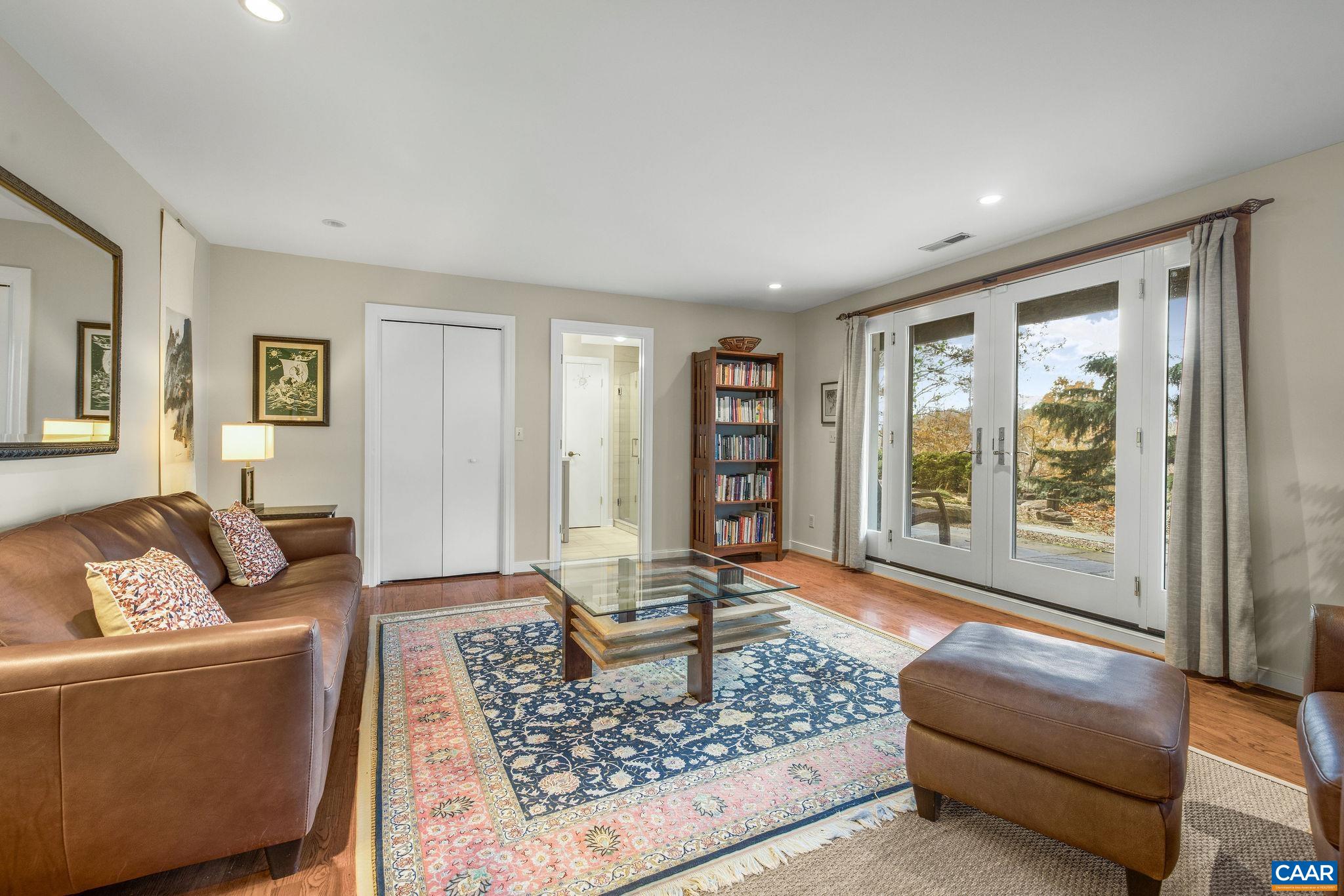 407 Broad Axe Road Charlottesville, VA 22903 - Photo 51 of 57 a living room with furniture and a rug