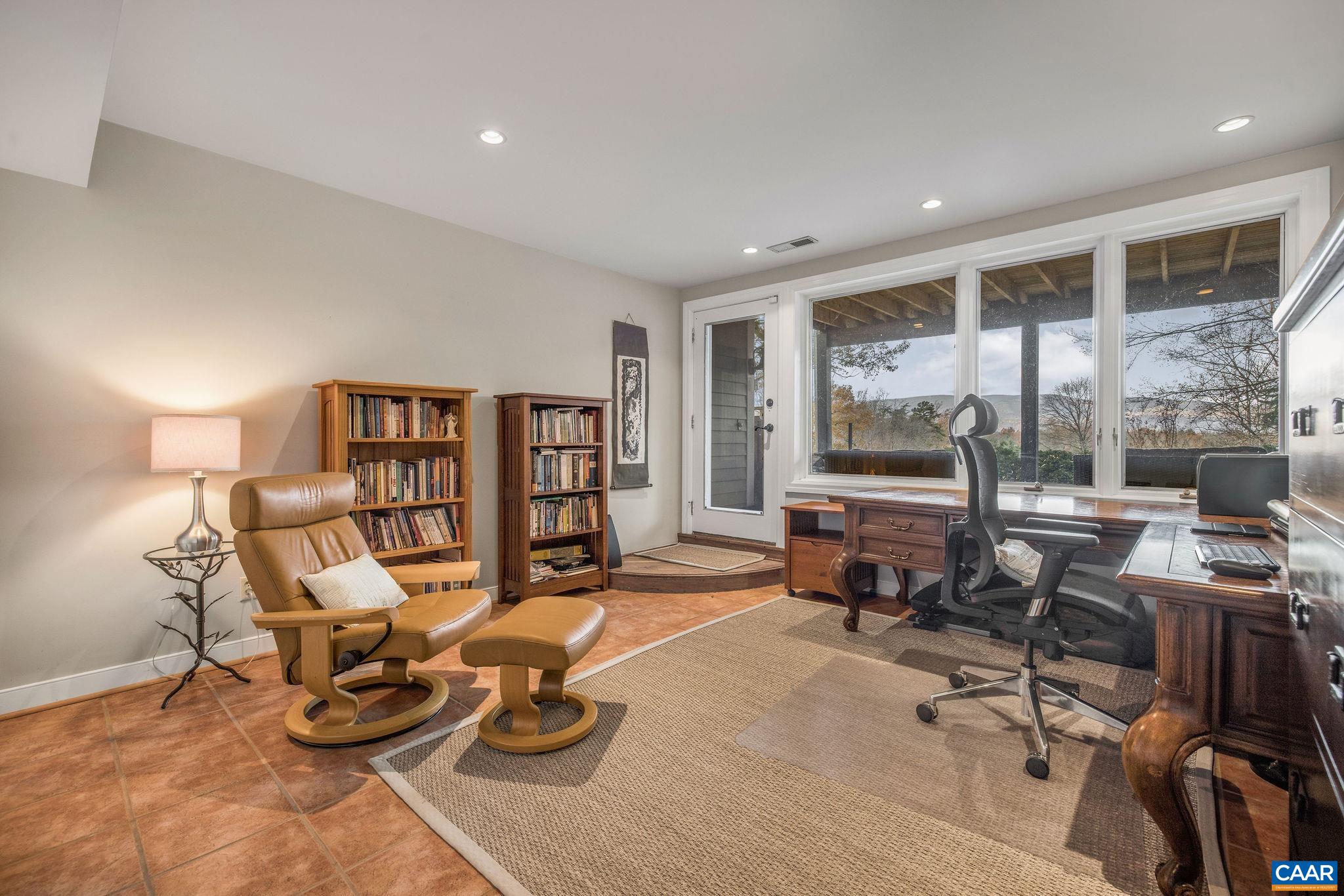 407 Broad Axe Road Charlottesville, VA 22903 - Photo 54 of 57 a room with furniture and a large window