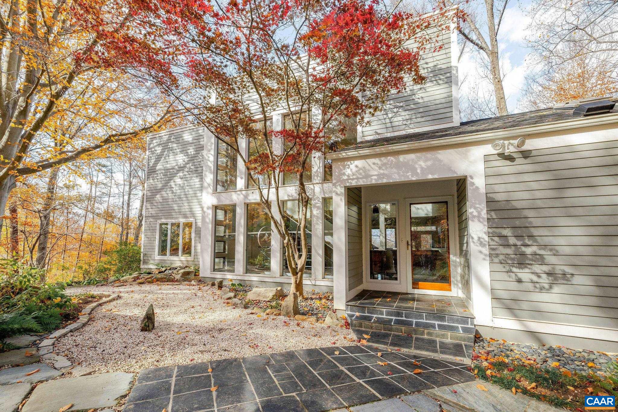 407 Broad Axe Road Charlottesville, VA 22903 - Photo 9 of 57 a view of a brick house with a large windows