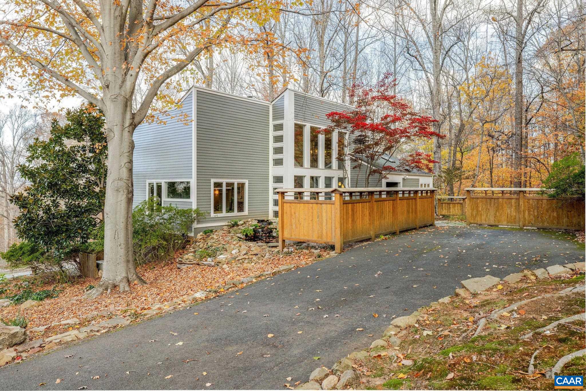 407 Broad Axe Road Charlottesville, VA 22903 - Photo 10 of 57 a front view of a house with a yard covered with snow