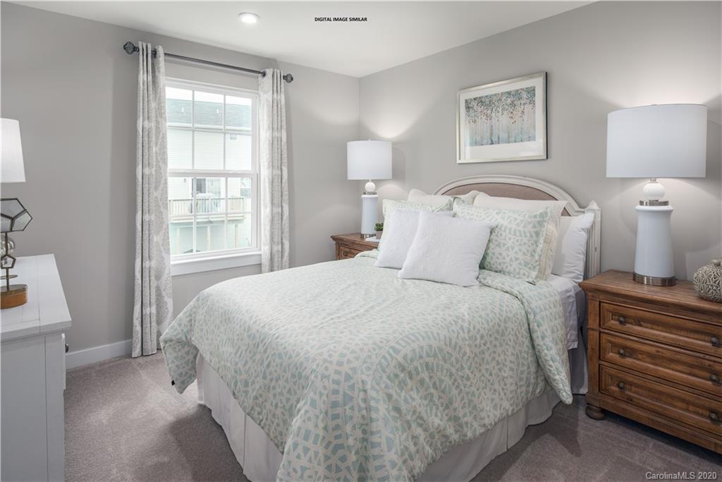 7120 Messina Road, Unit 135 Indian Land, SC 29707 - Photo 3 of 10 a bedroom with a bed and a window