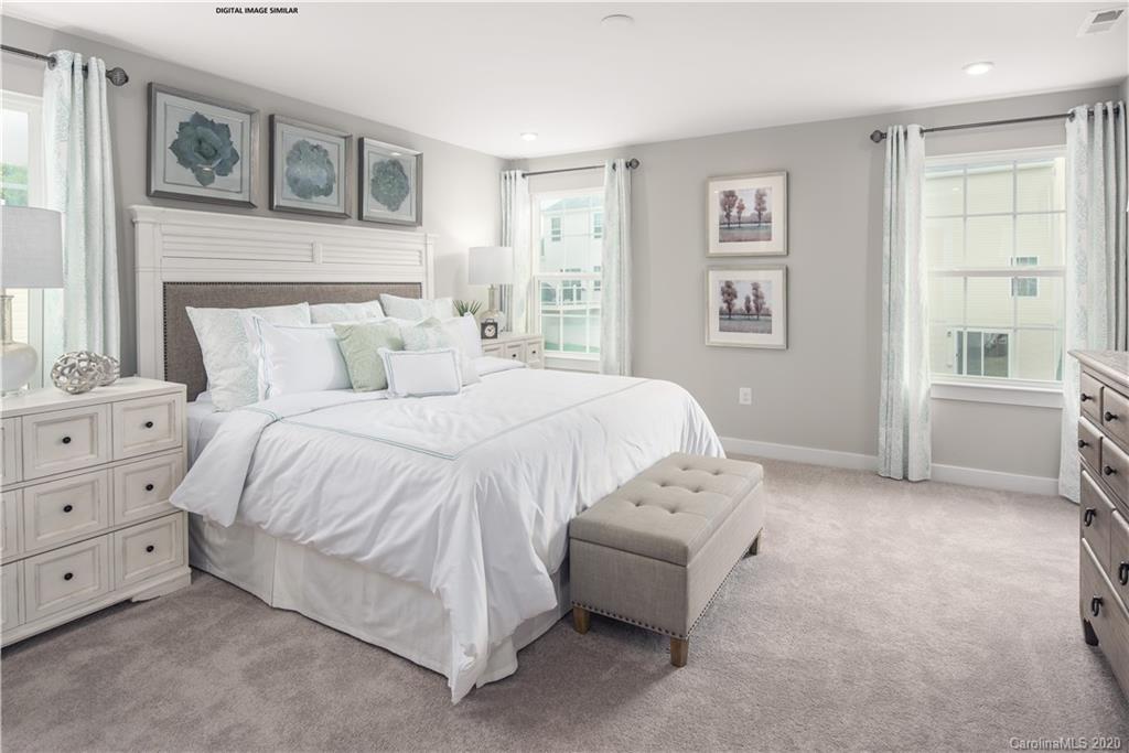 7120 Messina Road, Unit 135 Indian Land, SC 29707 - Photo 7 of 10 a bedroom with a bed and a window