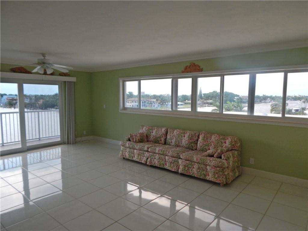 1201 South Riverside Drive, Unit PHB Pompano Beach, FL 33062 - Photo 14 of 33 a living room with furniture and a large window