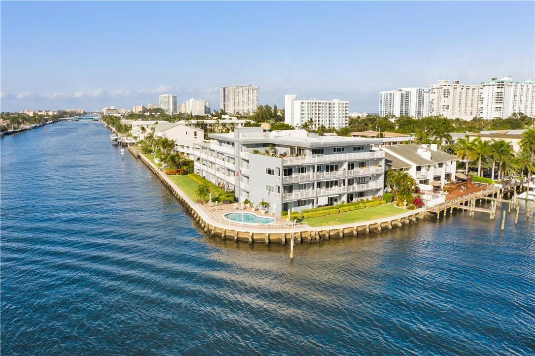 1201 South Riverside Drive, Unit PHB Pompano Beach, FL 33062 - Photo 30 of 33 a view of a swimming pool with outdoor seating