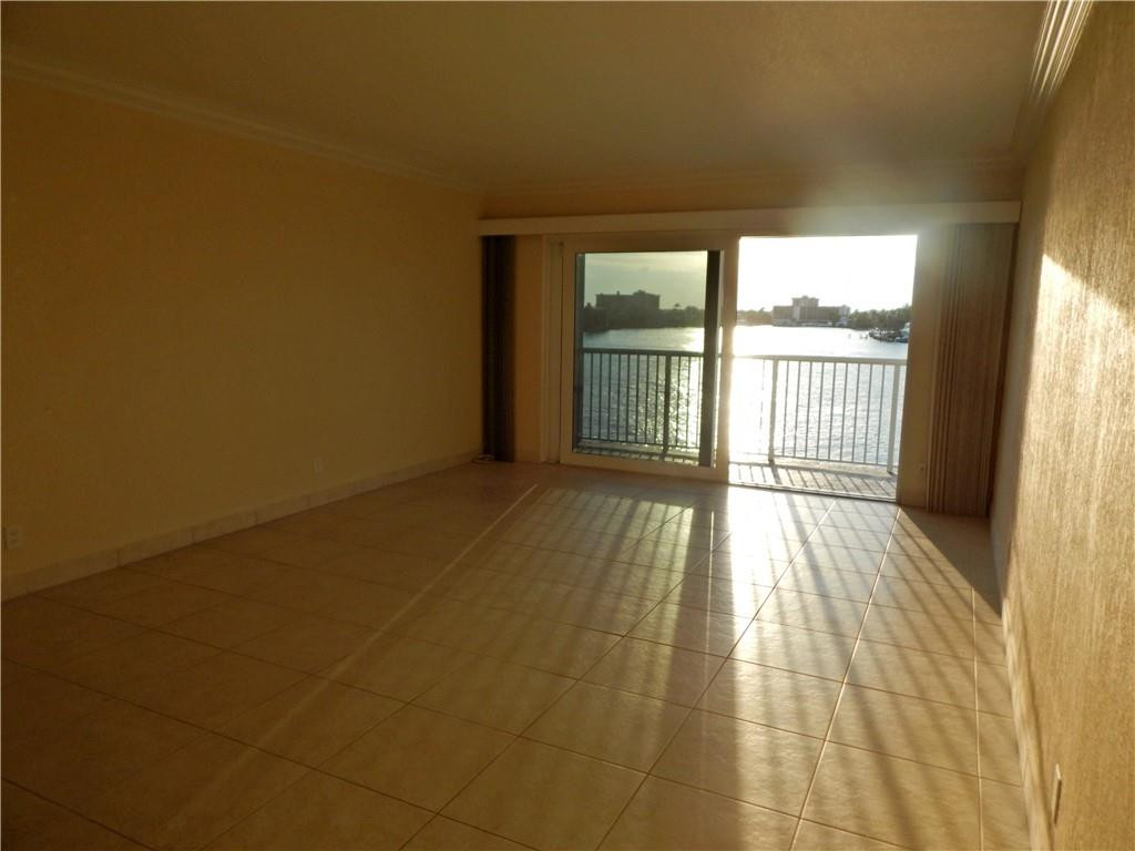 1201 South Riverside Drive, Unit PHB Pompano Beach, FL 33062 - Photo 9 of 33 a view of an empty room and window