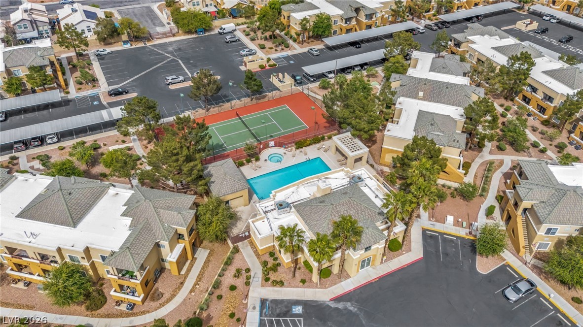 8070 West Russell Road, Unit 2060 Las Vegas, NV 89113 - Photo 45 of 47 An aerial view showcases a vibrant community with recreational amenities and residential buildings.