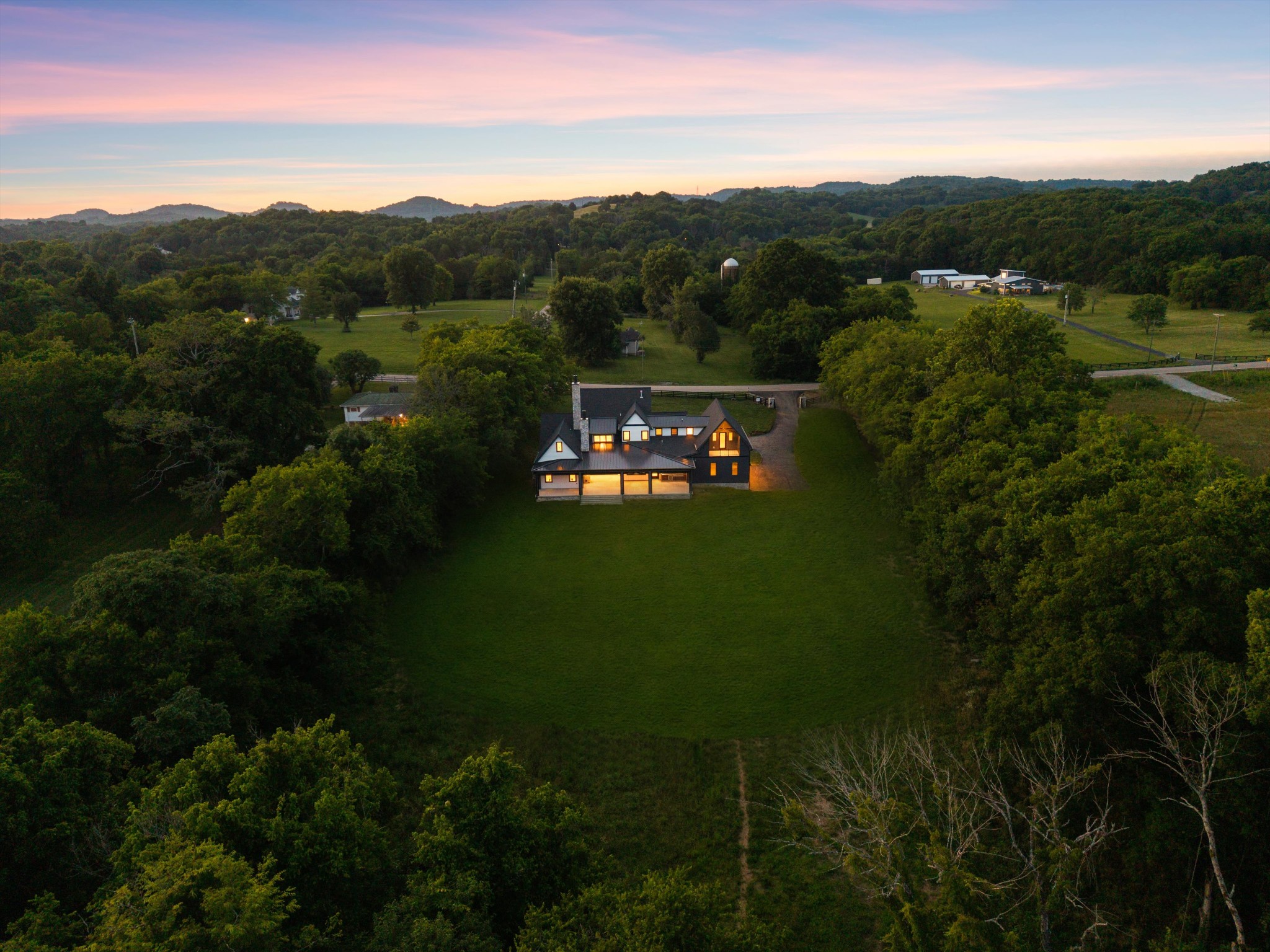 6801 Flat Creek Road College Grove, TN 37046 - Photo 4 of 66 a view of a city with lush green forest