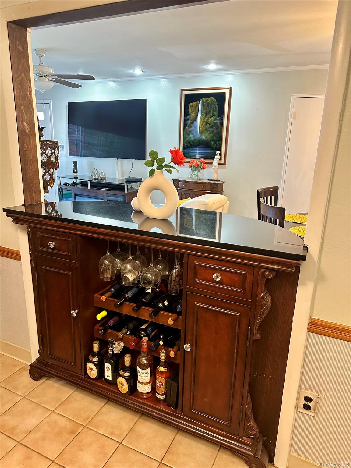 124 Santa Barbara Drive Plainview, NY 11803 - Photo 14 of 24 a room with a mirror and a flat screen tv