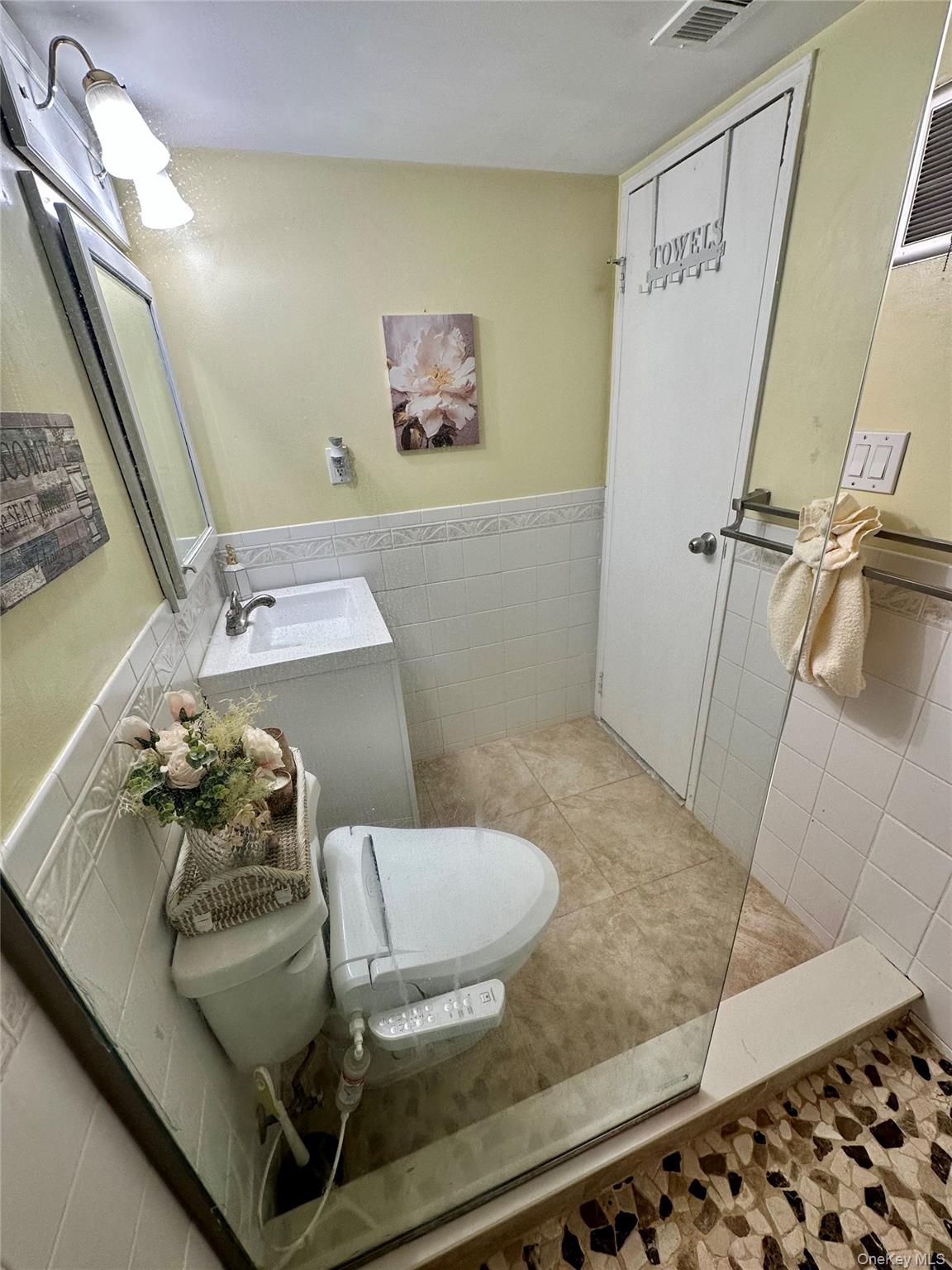 124 Santa Barbara Drive Plainview, NY 11803 - Photo 17 of 24 a bathroom with a sink and toilet