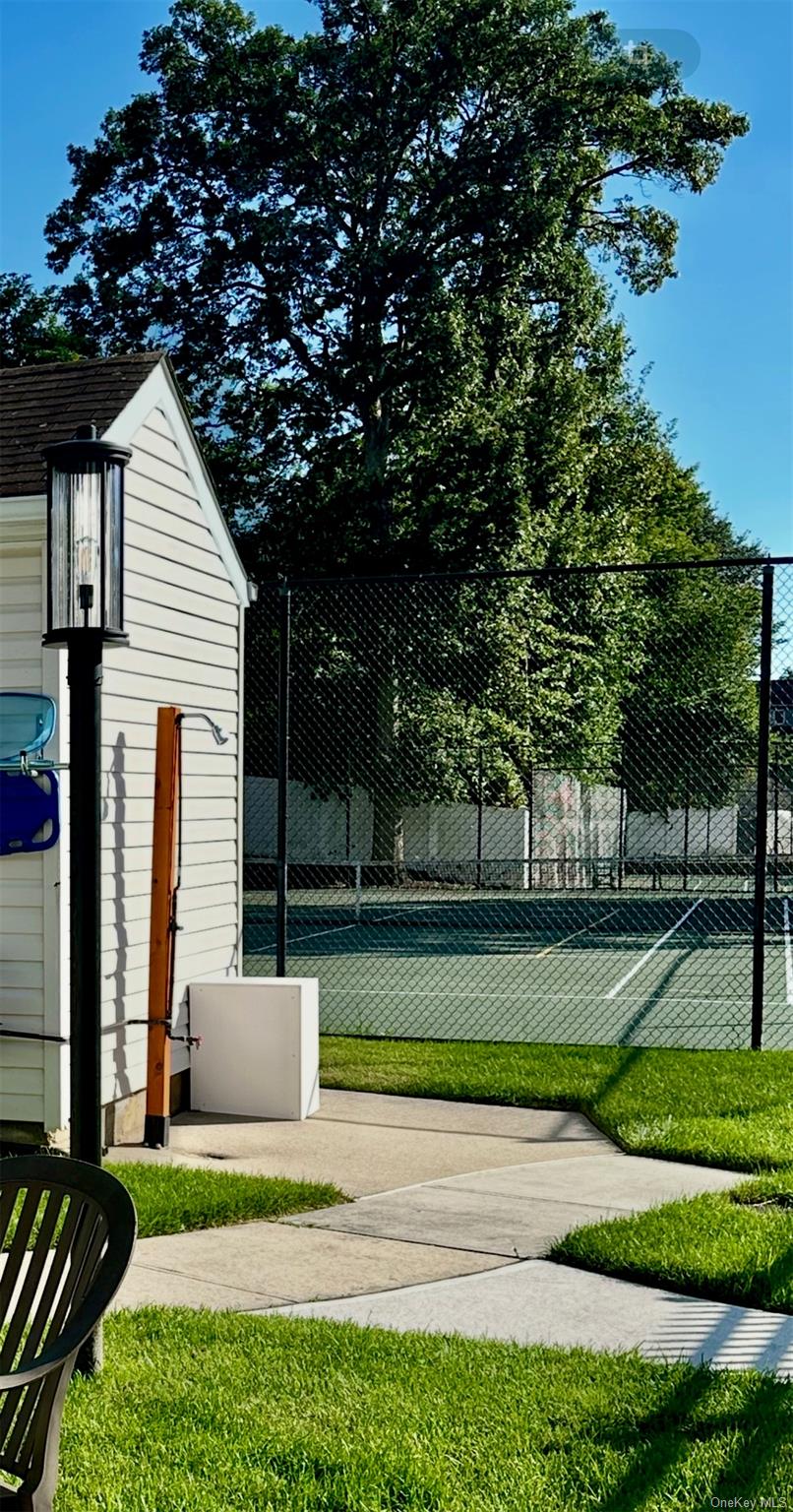 124 Santa Barbara Drive Plainview, NY 11803 - Photo 21 of 24 a front view of a house with a yard