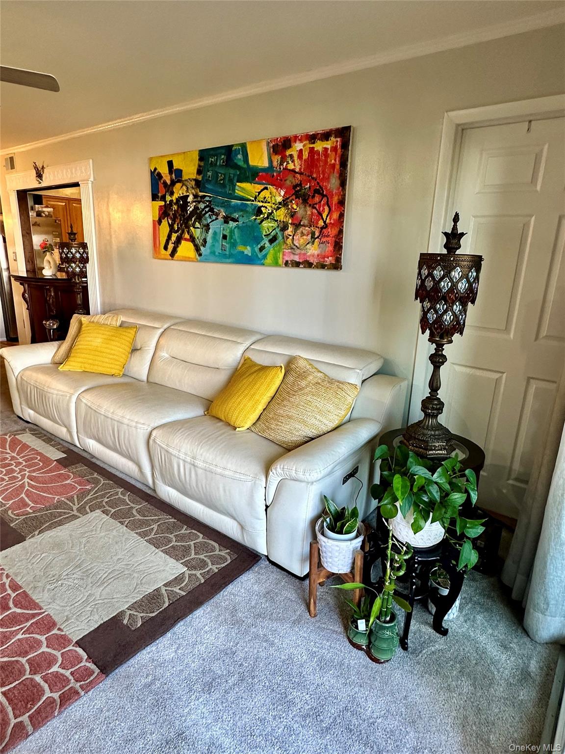 124 Santa Barbara Drive Plainview, NY 11803 - Photo 5 of 24 a living room with furniture and flowers