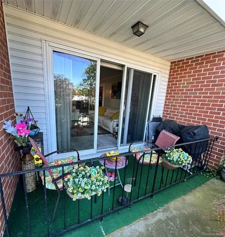 a room with lots of flowers and table
