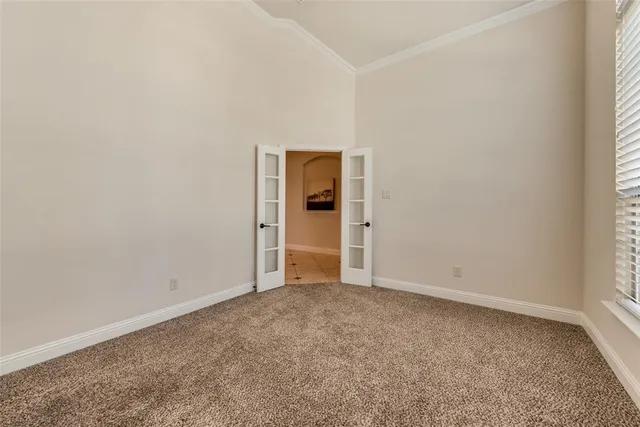 an empty room with closet area