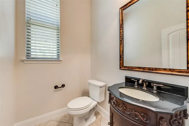 a kitchen with stainless steel appliances granite countertop a stove a sink a oven and a refrigerator