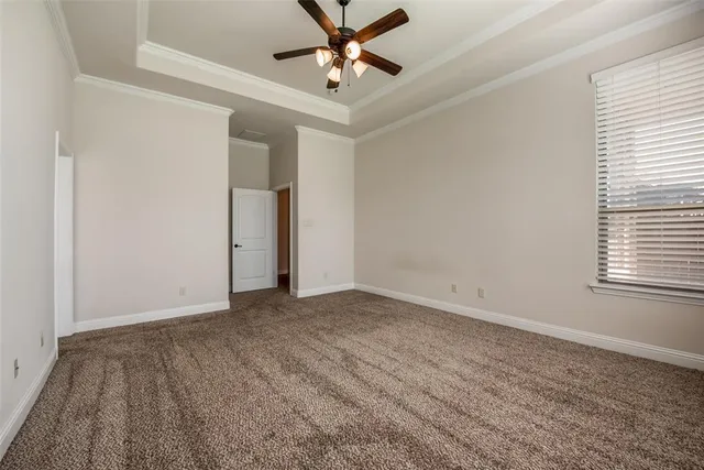 a bathroom with a granite countertop sink toilet and mirror